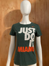 NIKE "JUST DO IT MIAMI" UNIVERSITY OF MIAMI SLIM FIT Graphic Print Adult T-Shirt Tee Shirt M Medium MD Dark Green Shirt